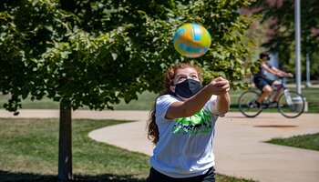 Student playing volleyball