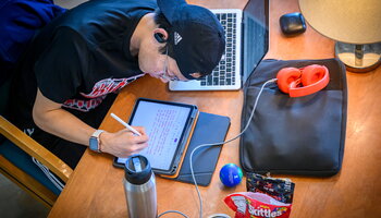 Student studying on multiple devices