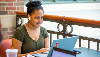 Student studying on laptop